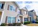 Side view of townhouses shows manicured shrubs and a convenient satellite dish at 2326 Bigwood Trl, Atlanta, GA 30349