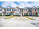Townhouse complex showcases ample parking, well-kept lawns, and tidy landscaping at 2326 Bigwood Trl, Atlanta, GA 30349