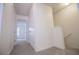 Light and bright hallway featuring carpeted floors and white walls at 2326 Bigwood Trl, Atlanta, GA 30349