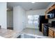 Functional kitchen features essential appliances, practical countertops, and tiled floor at 2326 Bigwood Trl, Atlanta, GA 30349