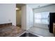 Spacious kitchen with tile floors, a pantry, and modern appliances at 2326 Bigwood Trl, Atlanta, GA 30349
