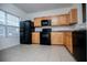 Bright kitchen with tile floors, a window and black appliances at 2326 Bigwood Trl, Atlanta, GA 30349