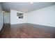 Expansive living room boasting stylish hardwood floors and a peek into the modern kitchen at 2326 Bigwood Trl, Atlanta, GA 30349