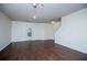 Spacious living room featuring hardwood floors, bright white walls, and modern lighting at 2326 Bigwood Trl, Atlanta, GA 30349