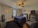 Bedroom featuring a TV, a chair and warm interior lighting at 2056 Merle Se Dr, Conyers, GA 30013