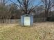 Backyard featuring a small storage shed at 2056 Merle Se Dr, Conyers, GA 30013