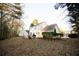 Backyard with covered patio and landscaping of two-story home at 392 Summerfield Xing, Acworth, GA 30101