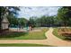 Community playground and tennis court surrounded by greenery at 392 Summerfield Xing, Acworth, GA 30101