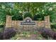 Stone community entrance sign for Summerfield, surrounded by lush landscaping and greenery at 392 Summerfield Xing, Acworth, GA 30101