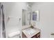 Bathroom with a shower/tub combo, granite countertop, and double mirror at 4422 Wellington Ter, Decatur, GA 30035