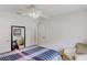 Comfortable bedroom with a white ceiling fan, a queen bed, and a sitting chair at 4422 Wellington Ter, Decatur, GA 30035