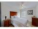 Comfortable bedroom features a bed with a striped comforter, a window, and wooden dresser at 4422 Wellington Ter, Decatur, GA 30035