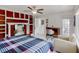 Bright bedroom featuring a fireplace, built-in shelving, and walk-out door at 4422 Wellington Ter, Decatur, GA 30035