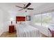 Bright bedroom with a ceiling fan, large window, wood floors, and desk at 4422 Wellington Ter, Decatur, GA 30035