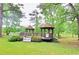 Charming gazebo overlooking the lake, ideal for relaxation and enjoying nature at 447 Hemlock Dr, Pine Lake, GA 30083