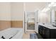 Well-lit bathroom featuring a bathtub and a view into the main bedroom at 1945 Bay Beauty Ln # 10, Austell, GA 30106