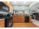 Functional kitchen with stainless steel appliances and ample cabinet space, looking into the living spaces at 1945 Bay Beauty Ln # 10, Austell, GA 30106