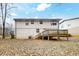 View of the backyard with deck and lawn at 2284 Emerald Springs Dr, Decatur, GA 30035