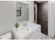 Well-lit bathroom featuring a single sink vanity, a large mirror, and a shower-tub combo at 2284 Emerald Springs Dr, Decatur, GA 30035