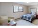 Bedroom with a window bringing in natural light, an armchair, and a bed at 2284 Emerald Springs Dr, Decatur, GA 30035