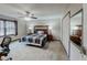 Comfortable bedroom featuring neutral walls, carpet flooring, ceiling fan, and double mirrored sliding door closet at 2284 Emerald Springs Dr, Decatur, GA 30035