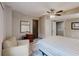 Bedroom featuring a comfortable bed, a chair, a ceiling fan and hardwood floors at 2284 Emerald Springs Dr, Decatur, GA 30035