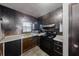 Efficient kitchen featuring dark wood cabinets, laminate countertops, and essential appliances at 2284 Emerald Springs Dr, Decatur, GA 30035