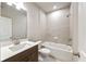 Beautiful full bathroom featuring a shower over tub and light, neutral tones at 2460 Hidden Creek Rd, Kennesaw, GA 30152