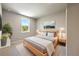 Bright and airy bedroom with a large window, neutral walls and a queen-size bed at 2460 Hidden Creek Rd, Kennesaw, GA 30152