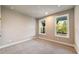 Cozy bedroom with neutral colors, natural light, and new carpet at 2460 Hidden Creek Rd, Kennesaw, GA 30152