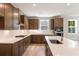 This kitchen features stainless steel appliances, granite countertops, and custom cabinetry at 2460 Hidden Creek Rd, Kennesaw, GA 30152