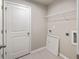 Functional laundry room with modern fixtures, a utility sink, and ample storage at 2460 Hidden Creek Rd, Kennesaw, GA 30152