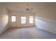 This light-filled bedroom features neutral carpet, a ceiling fan, and direct access to the outdoors at 2661 Rivers Edge Ne Dr, Atlanta, GA 30324