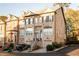 This brick townhome features two stories, a two-car garage, and manicured landscaping at 2661 Rivers Edge Ne Dr, Atlanta, GA 30324