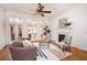 Inviting living room featuring a fireplace, hardwood floors, and a large windows to the deck at 2661 Rivers Edge Ne Dr, Atlanta, GA 30324