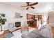 Open-concept living room with fireplace, hardwood floors, and seamless flow into the kitchen at 2661 Rivers Edge Ne Dr, Atlanta, GA 30324