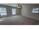 Carpeted bedroom bathed in sunlight from multiple windows, offering a serene retreat at 3924 Veracruz Dr, Decatur, GA 30034