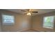 Bedroom featuring neutral walls, plush carpeting, a ceiling fan and windows at 3924 Veracruz Dr, Decatur, GA 30034