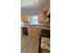 Eat-in kitchen boasts granite countertops, stainless steel sink, and wooden cabinets at 3924 Veracruz Dr, Decatur, GA 30034