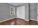 Bedroom featuring wood floors, fresh paint, a window, and double door closet at 765 Shellnut Dr, Forest Park, GA 30297