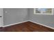 Bedroom with wood floors, fresh paint, and a window that provides natural light at 765 Shellnut Dr, Forest Park, GA 30297