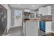 Modern kitchen featuring stainless steel appliances, white cabinets, tile backsplash, and a butcher block countertop at 765 Shellnut Dr, Forest Park, GA 30297