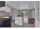 Open kitchen with gray vinyl floor and view of the living room at 765 Shellnut Dr, Forest Park, GA 30297