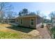 The backyard features a grassy area with some bare patches, partially fenced-in area and a freshly poured concrete patio at 1826 Terry Mill Se Rd, Atlanta, GA 30316