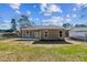 An open backyard featuring a concrete patio, a grassy area, and a partially fenced-in area at 1826 Terry Mill Se Rd, Atlanta, GA 30316