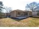 A spacious backyard with a concrete patio, lush grass, and a newly landscaped area at 1826 Terry Mill Se Rd, Atlanta, GA 30316