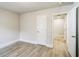 Bedroom with light wood floors and white doors leading to other rooms in the house at 1826 Terry Mill Se Rd, Atlanta, GA 30316