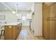 Open concept kitchen featuring a large island with seating, stainless steel appliances, and custom cabinetry at 1826 Terry Mill Se Rd, Atlanta, GA 30316