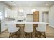 Bright kitchen featuring stylish pendant lighting, barstool seating at the island, and stainless steel appliances at 1826 Terry Mill Se Rd, Atlanta, GA 30316