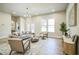 Inviting living room with natural light, neutral tones, and a decorative chandelier creates a relaxing atmosphere at 1826 Terry Mill Se Rd, Atlanta, GA 30316